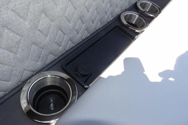 Slide: The Image of 2026 Bennington M Swingback 24 MSB interior with cup holders and textured upholstery. - 14