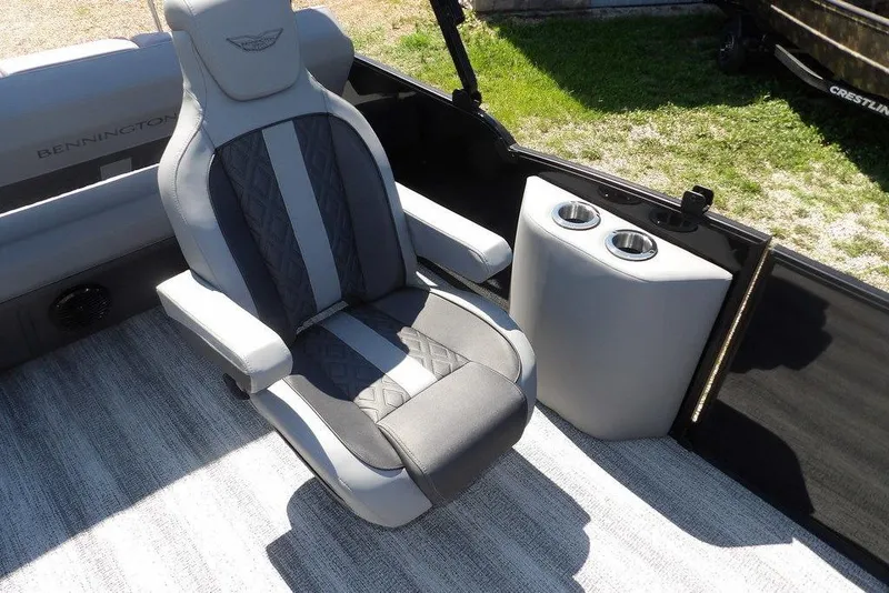Slide: The Image of 2026 Bennington M Swingback 24 MSB boat interior with luxury seating and cup holders. - 25