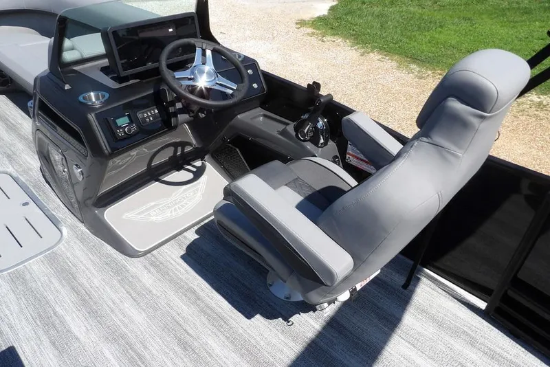 Slide: The Image of 2026 Bennington M Swingback 24 MSB boat interior with steering console and captain's chair. - 28