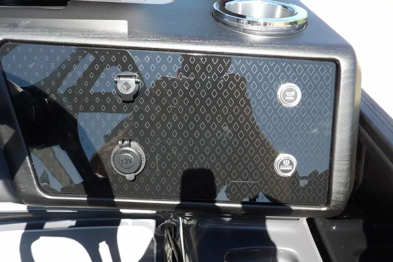 Slide: The Image of Control panel of 2026 Bennington M Swingback 24 MSB with power and 12V outlets. - 30