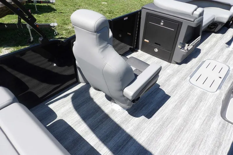 Slide: The Image of 2026 Bennington M Swingback 24 MSB boat interior with gray seating and storage compartments. - 34