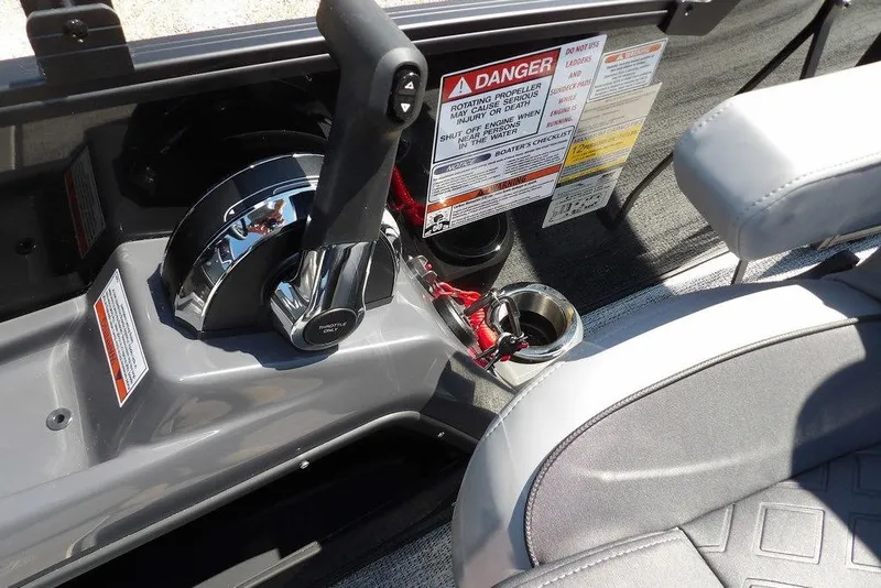 Slide: The Image of Throttle control and safety warnings on a 2026 Bennington M Swingback 24 MSB boat. - 35