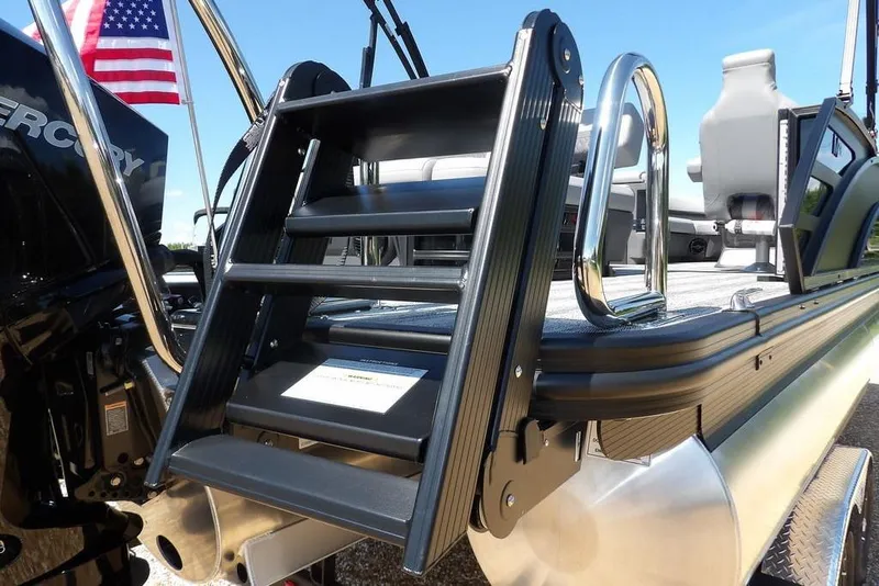 Slide: The Image of 2026 Bennington M Swingback 24 MSB boat with ladder and American flag. - 56