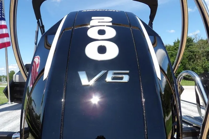 Slide: The Image of Close-up of a Mercury 200 V6 engine on a 2026 Bennington M Swingback 24 MSB boat. - 60