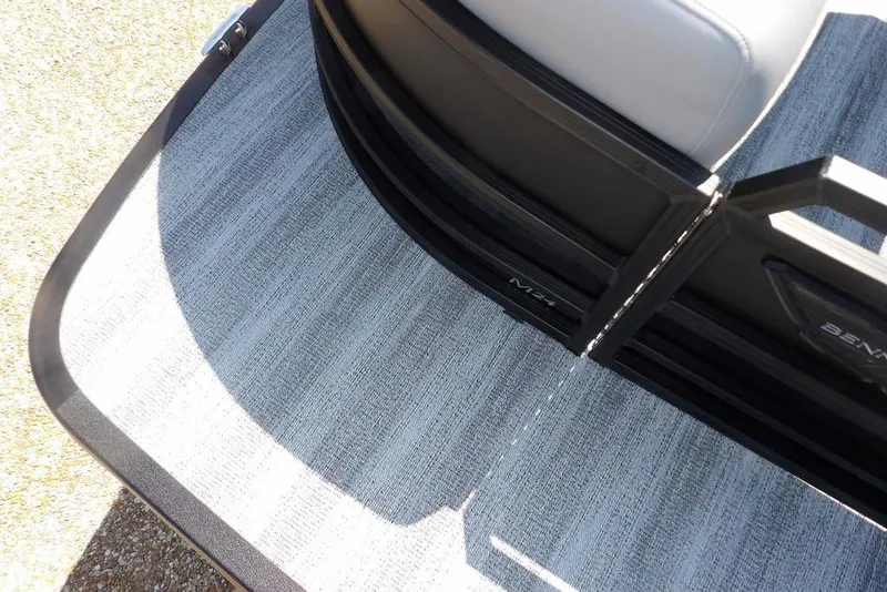 Slide: The Image of 2026 Bennington M Swingback 24 MSB boat interior with stylish flooring and seating. - 9