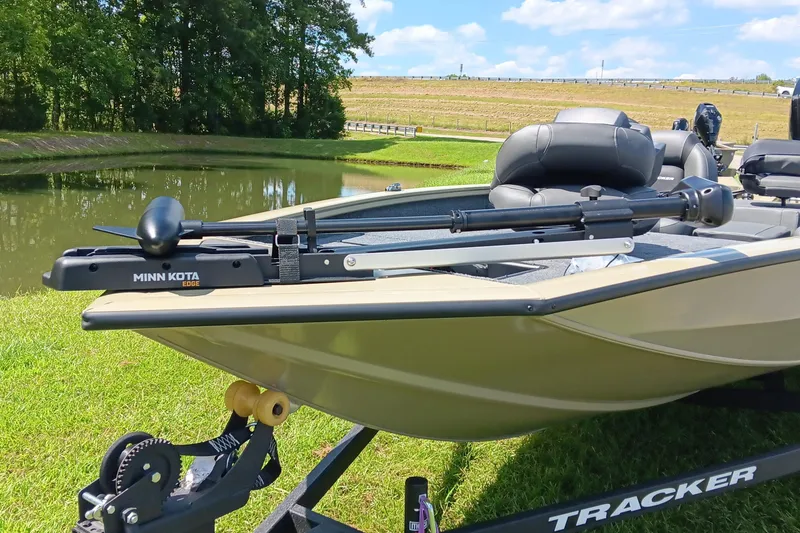 Slide: The Image of 2026 Tracker Pro Team 175 boat with Minn Kota Edge motor by a pond. - 8