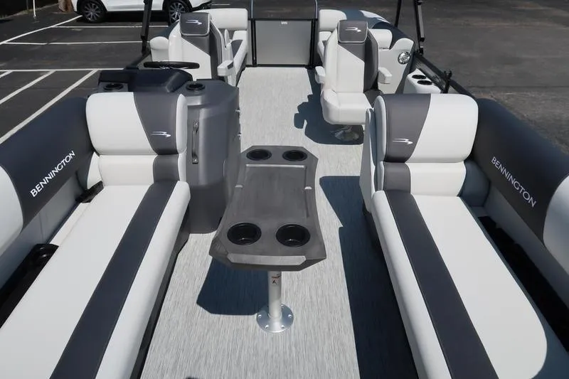Slide: The Image of 2026 Bennington S Quad Bench 22 SSR interior with stylish seating and central table. - 17