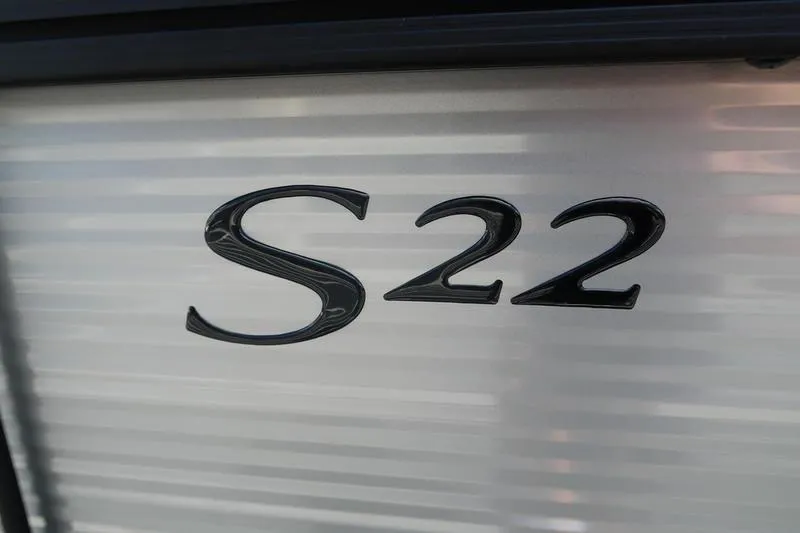 Slide: The Image of Close-up of 'S22' emblem on 2026 Bennington S Quad Bench 22 SSR. - 18