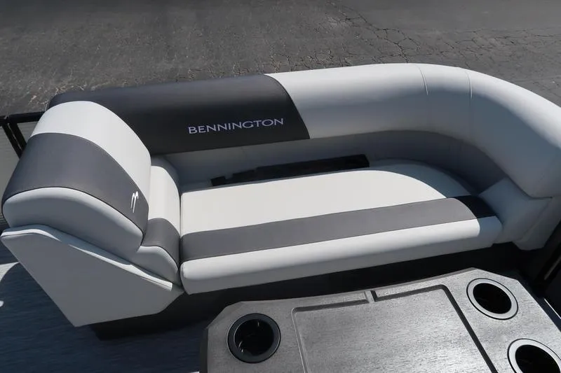 Slide: The Image of 2026 Bennington S Quad Bench 22 SSR boat seating with cup holders, featuring sleek design. - 22
