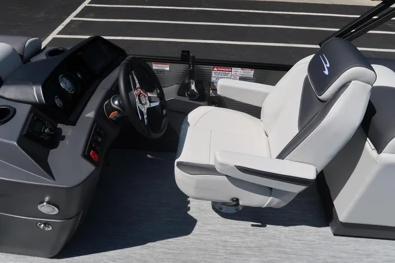 Slide: The Image of Captain's chair and helm of 2026 Bennington S Quad Bench 22 SSR pontoon boat. - 28