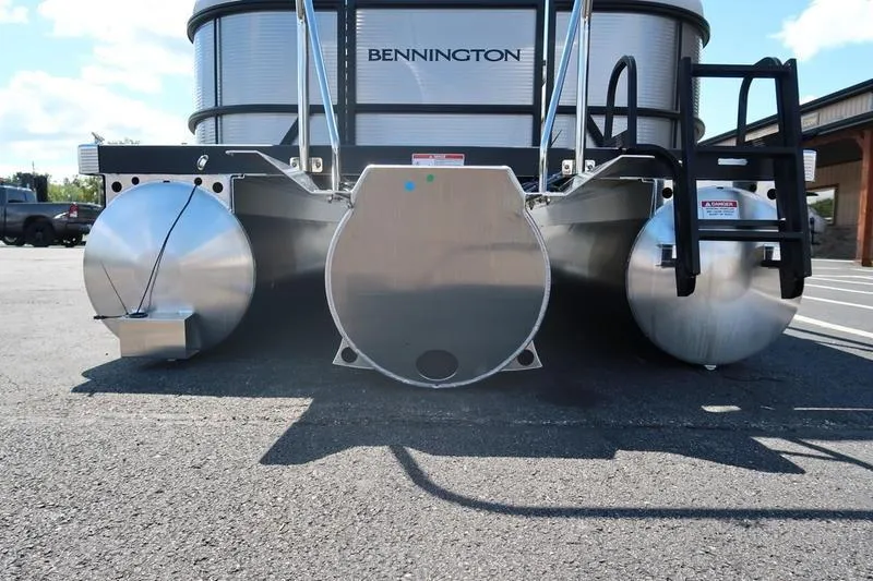 Slide: The Image of 2026 Bennington S Quad Bench 22 SSR pontoon boat rear view in parking lot. - 4