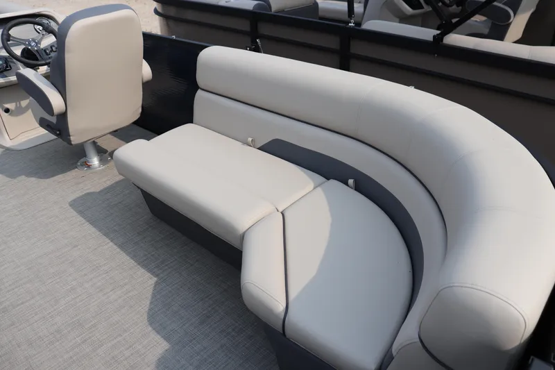 Slide: The Image of Luxurious seating on 2025 Flagship Freedom 22 CU boat, featuring plush beige upholstery. - 6