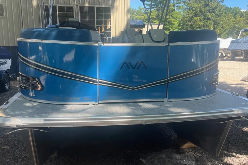 Slide: The Image of 2026 Avalon 23 LSZ Quad Lounger pontoon boat, blue exterior, parked outdoors. - 6