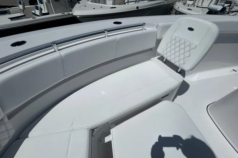 Slide: The Image of 2026 Sportsman Heritage 321 Center Console boat with white seating and sleek design. - 18