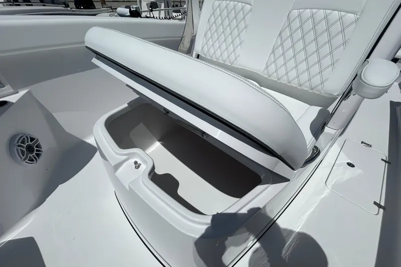 Slide: The Image of 2026 Sportsman Heritage 321 Center Console seat with open storage compartment. - 19