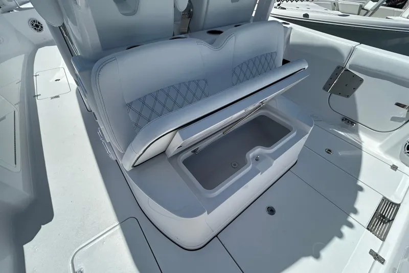 Slide: The Image of 2026 Sportsman Heritage 321 Center Console boat with open storage compartment. - 20