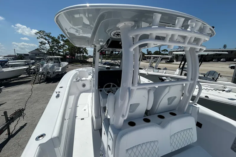 Slide: The Image of 2026 Sportsman Heritage 321 Center Console boat with sleek design and spacious seating. - 6