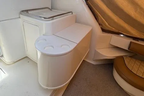 Slide: The Image of 2001 Sea Ray 340 Amberjack interior with seating and storage area. - 13