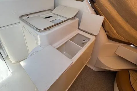 Slide: The Image of 2001 Sea Ray 340 Amberjack interior with storage compartments and seating area. - 14