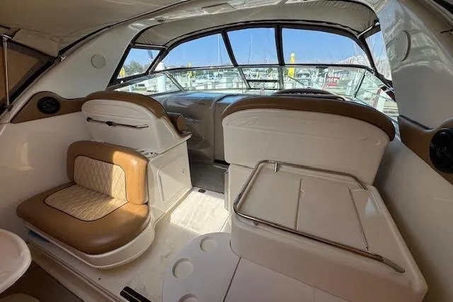 Slide: The Image of Interior of 2001 Sea Ray 340 Amberjack boat with tan and white seating. - 8
