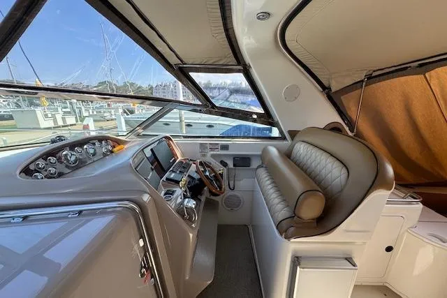 Slide: The Image of 2001 Sea Ray 340 Amberjack cockpit with leather seating and modern controls. - 9