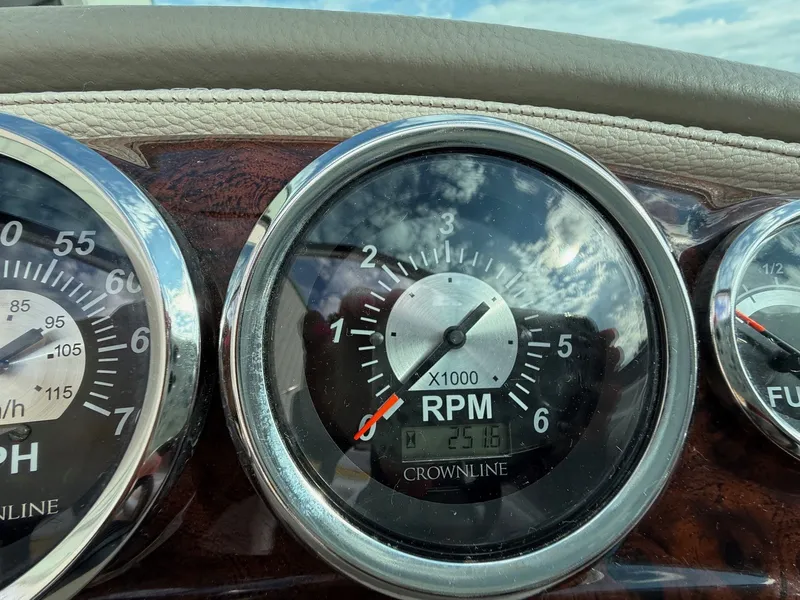 Slide: The Image of Close-up of 2012 Crownline 225 SS boat dashboard gauges, showing RPM and speed. - 14