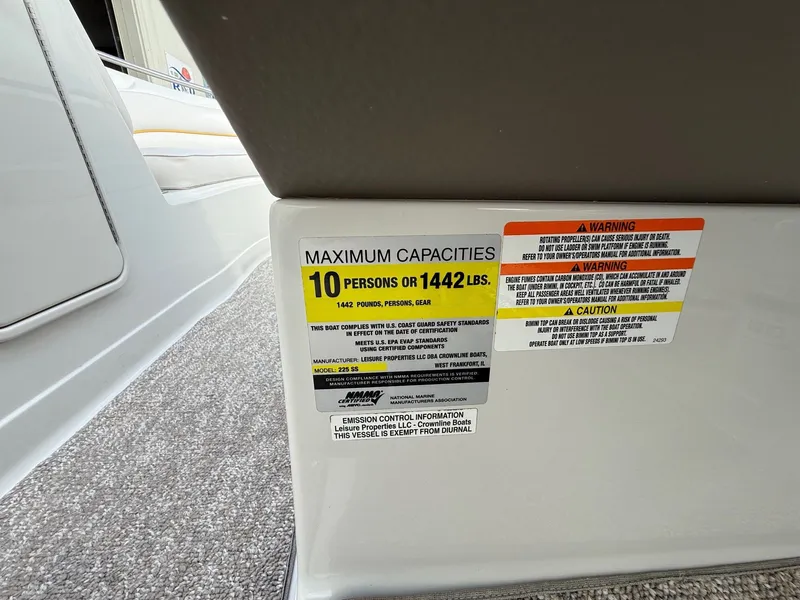 Slide: The Image of 2012 Crownline 225 SS boat capacity label, maximum 10 persons or 1442 lbs. - 16
