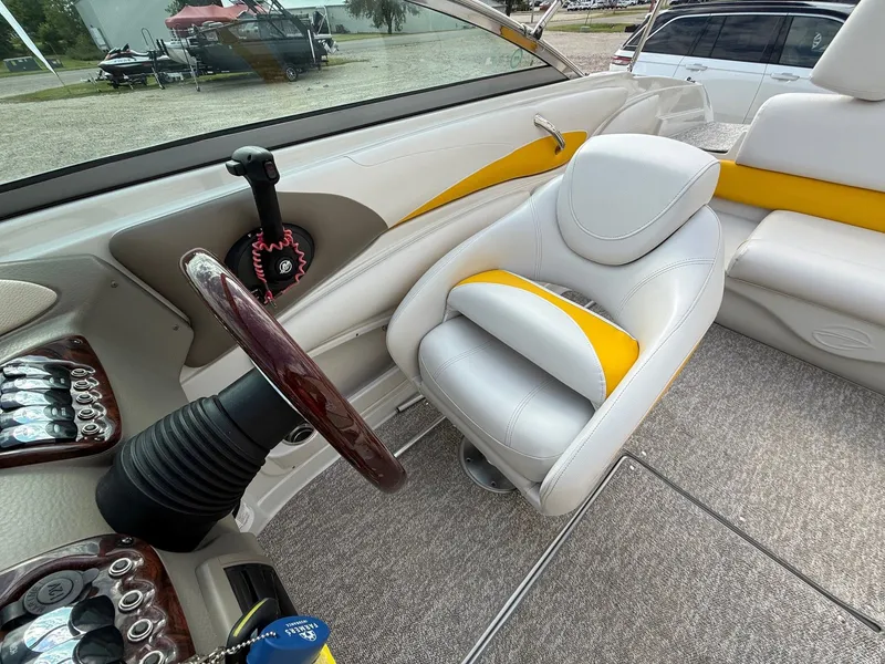 Slide: The Image of Interior of 2012 Crownline 225 SS boat with steering wheel and seating. - 18