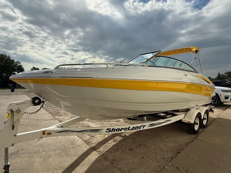 Slide: The Image of 2012 Crownline 225 SS boat on ShoreLand'r trailer, yellow and white design. - 2