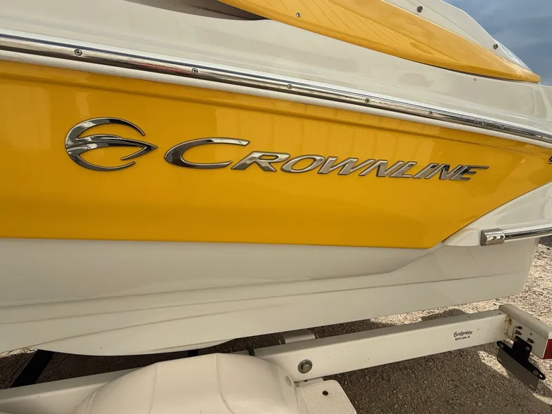 Slide: The Image of Yellow 2012 Crownline 225 SS boat side view with logo. - 4