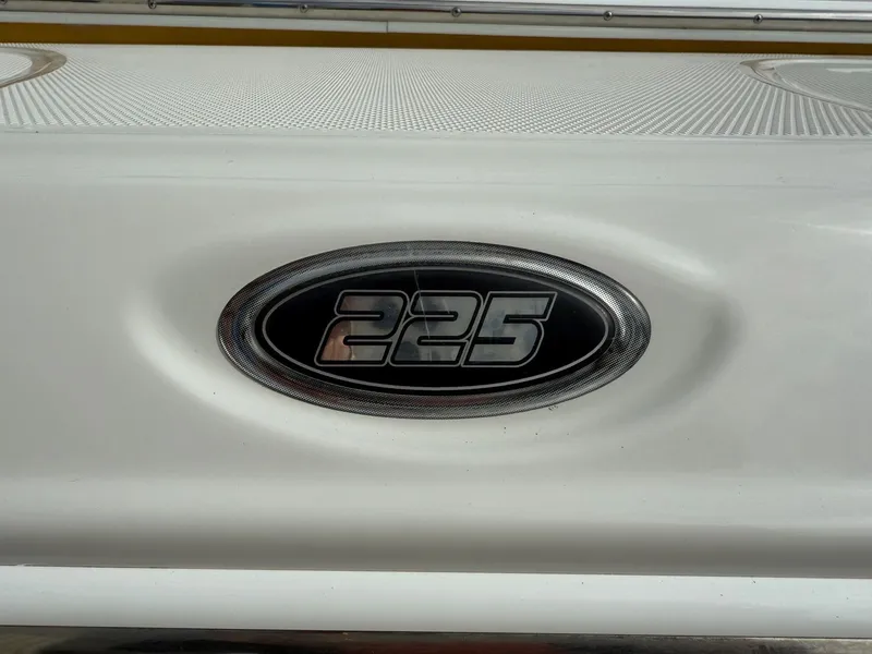 Slide: The Image of Crownline 225 SS 2012 model emblem on white surface. - 5