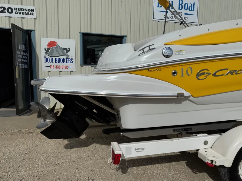 Slide: The Image of 2012 Crownline 225 SS boat with yellow accents, displayed at Boji Brokers. - 7