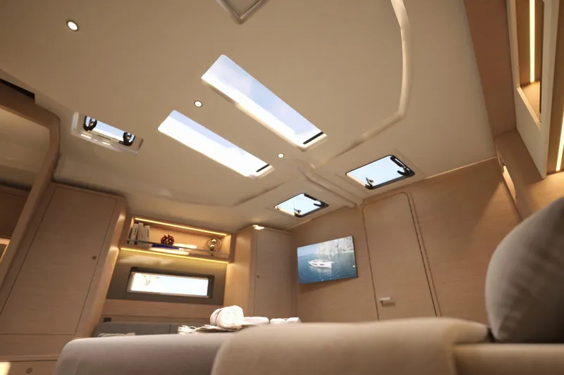 Slide: The Image of Luxurious interior of 2026 Dufour 54 yacht with skylights and modern decor. - 14