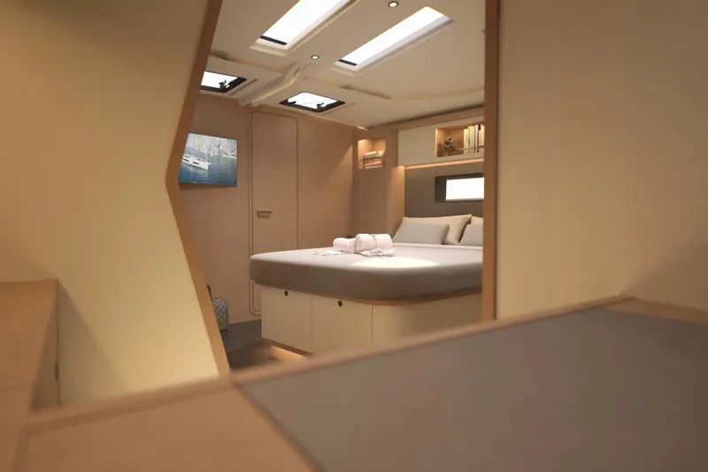 Slide: The Image of Luxurious interior of 2026 Dufour 54 yacht, featuring a cozy bedroom with modern design. - 24