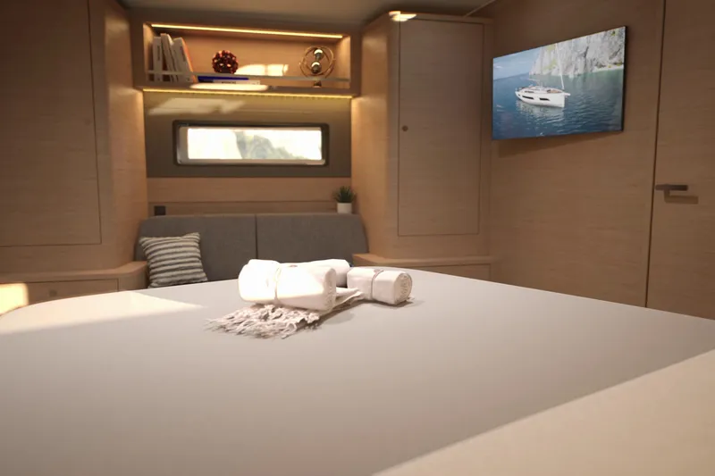 Slide: The Image of Interior of 2026 Dufour 54 yacht, featuring modern design and cozy seating area. - 26