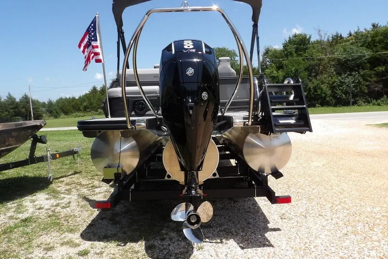 Slide: The Image of 2025 Bennington M Swingback 24 MSB pontoon boat with powerful outboard motor. - 14