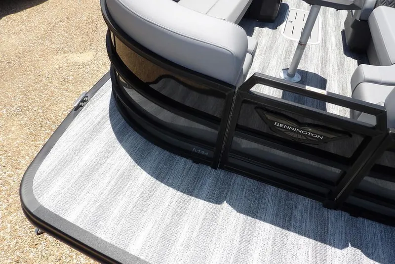 Slide: The Image of 2025 Bennington M Swingback 24 MSB pontoon boat with sleek seating and modern design. - 15