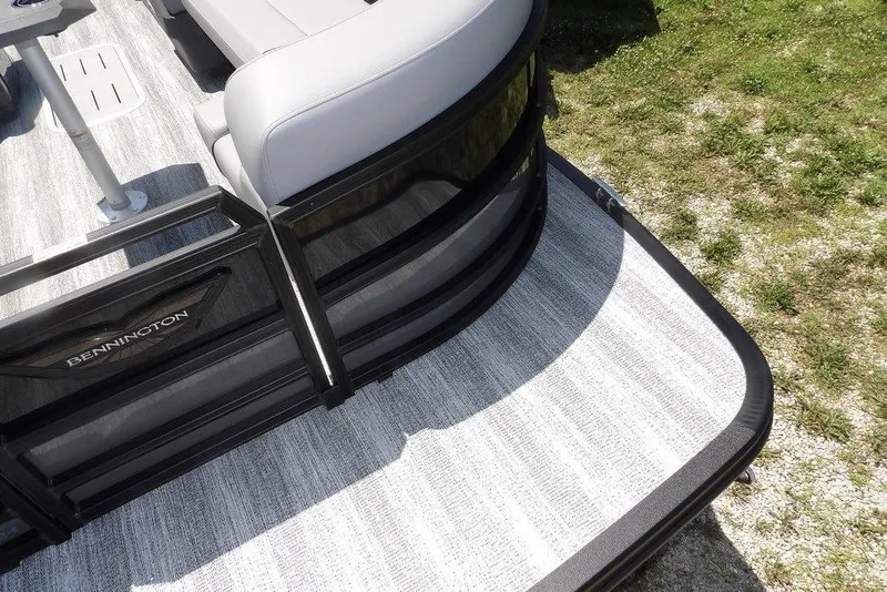 Slide: The Image of 2025 Bennington M Swingback 24 MSB pontoon boat with sleek design and comfortable seating. - 17