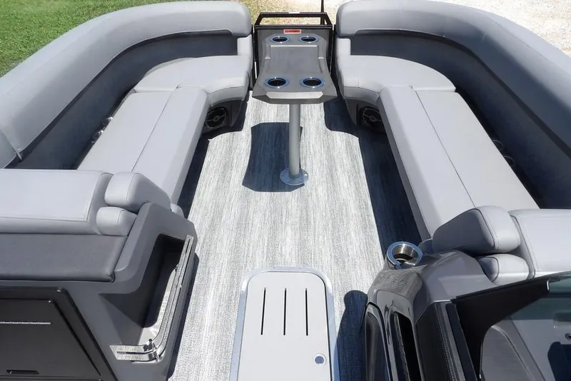 Slide: The Image of 2025 Bennington M Swingback 24 MSB interior with gray seating and central table. - 19