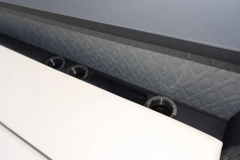 Slide: The Image of Interior of 2025 Bennington M Swingback 24 MSB with cup holders and quilted upholstery. - 23