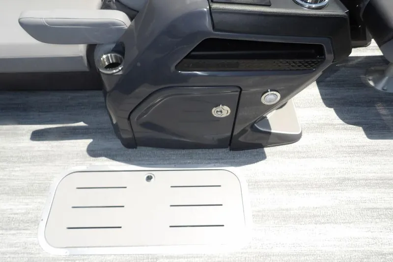 Slide: The Image of 2025 Bennington M Swingback 24 MSB interior console with storage and cup holder. - 25