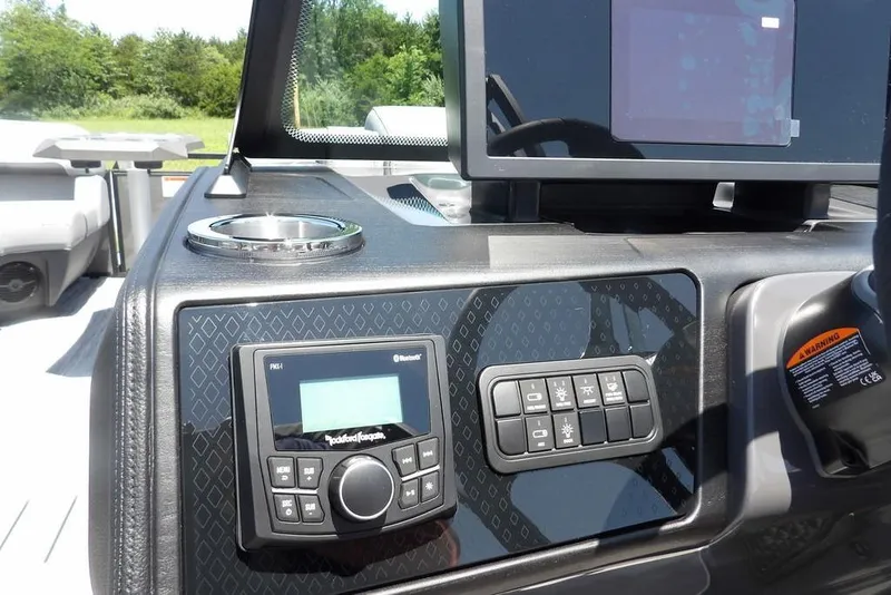 Slide: The Image of Dashboard of 2025 Bennington M Swingback 24 MSB with control panel and display screen. - 32