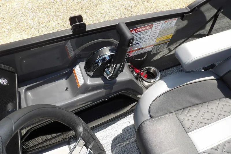 Slide: The Image of Interior of 2025 Bennington M Swingback 24 MSB boat, featuring control panel and seating. - 38