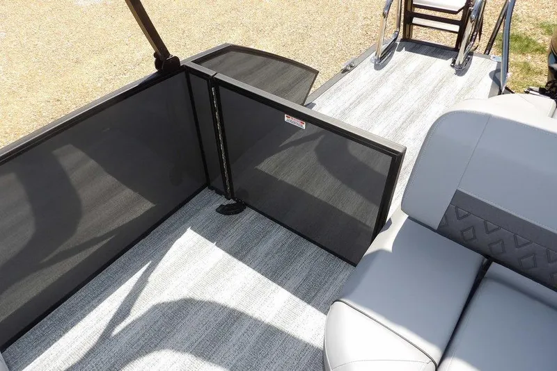 Slide: The Image of 2025 Bennington M Swingback 24 MSB boat interior with seating and safety gate. - 39