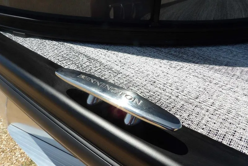 Slide: The Image of 2025 Bennington M Swingback 24 MSB boat cleat detail in sunlight. - 4