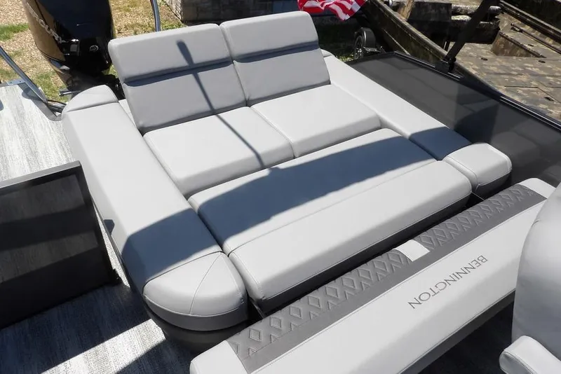 Slide: The Image of 2025 Bennington M Swingback 24 MSB boat with luxurious gray seating. - 42