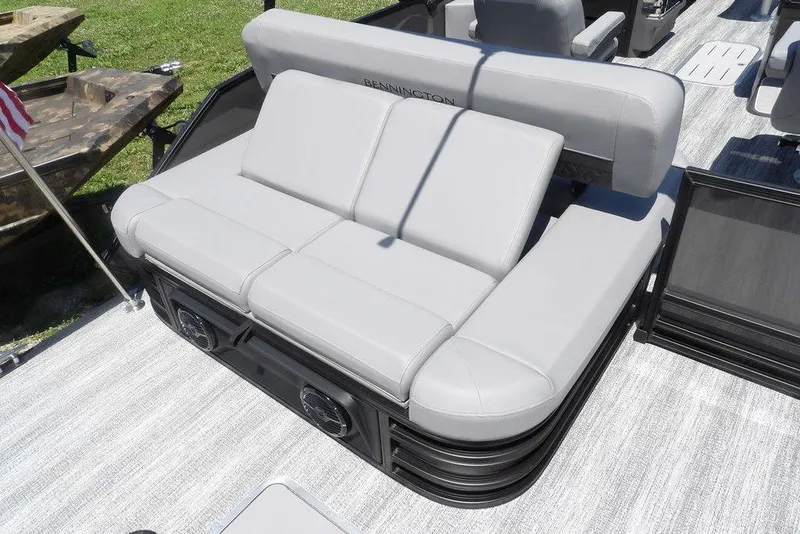 Slide: The Image of 2025 Bennington M Swingback 24 MSB boat with luxurious gray seating and modern design. - 44