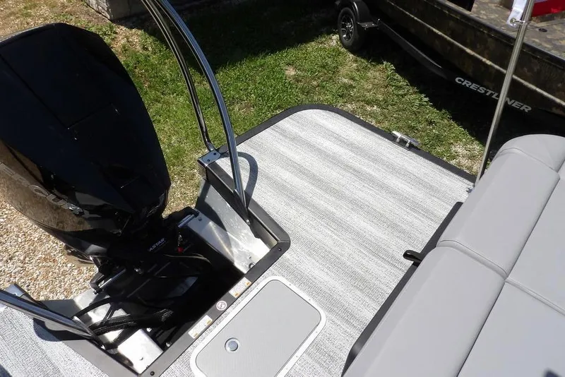 Slide: The Image of 2025 Bennington M Swingback 24 MSB boat deck with motor and seating area. - 46