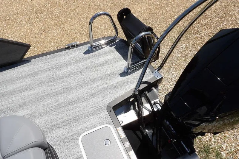 Slide: The Image of 2025 Bennington M Swingback 24 MSB boat deck with motor and ladder. - 48