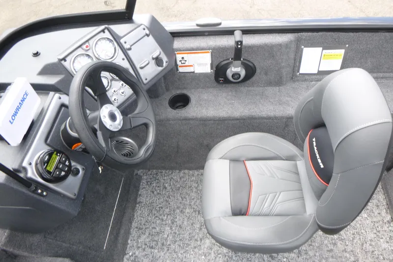 Slide: The Image of 2026 Tracker Pro Guide V-175 Combo boat interior with steering wheel and seat. - 10